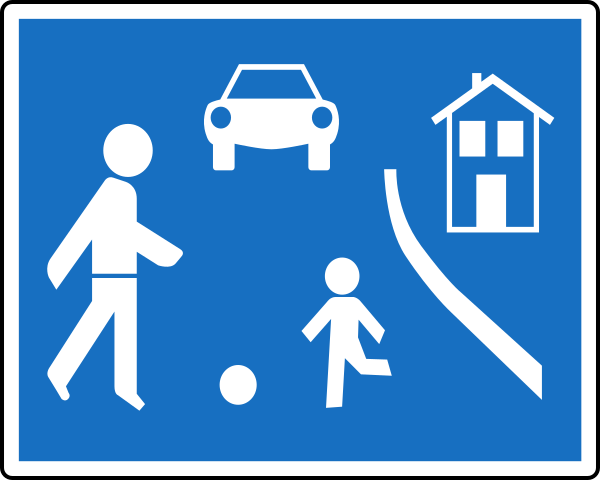 Verkehrstafel: Hinweiszeichen gem. § 53 Abs. 9c StVO 1960: Erwachsener und Kind spielen Ball. Im Hintergrund ein Haus und ein Auto.